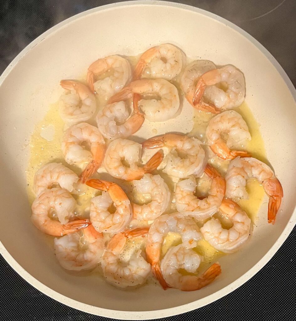 shrimp being sautee in butter