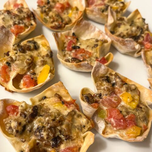Sausage wonton cups served on a platter