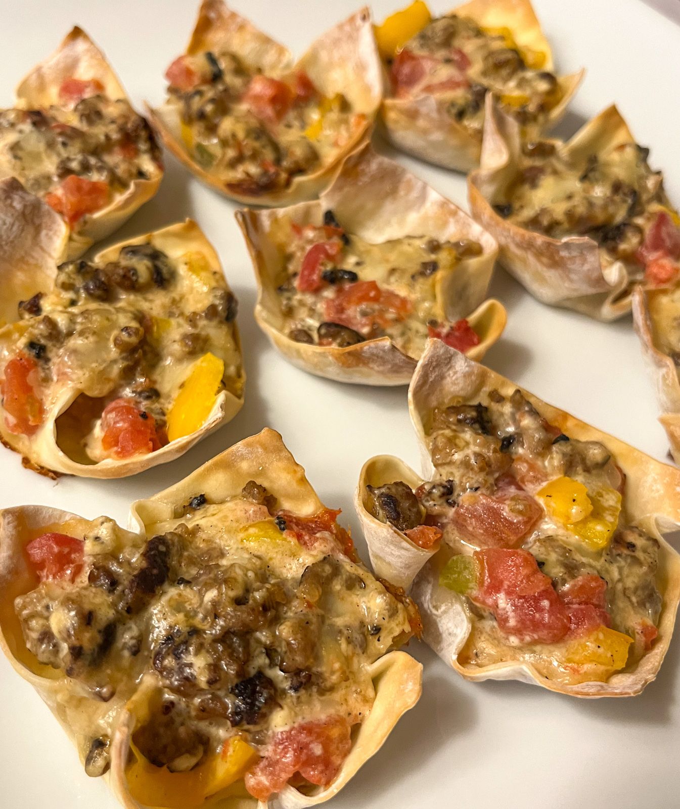 Sausage wonton cups served on a platter