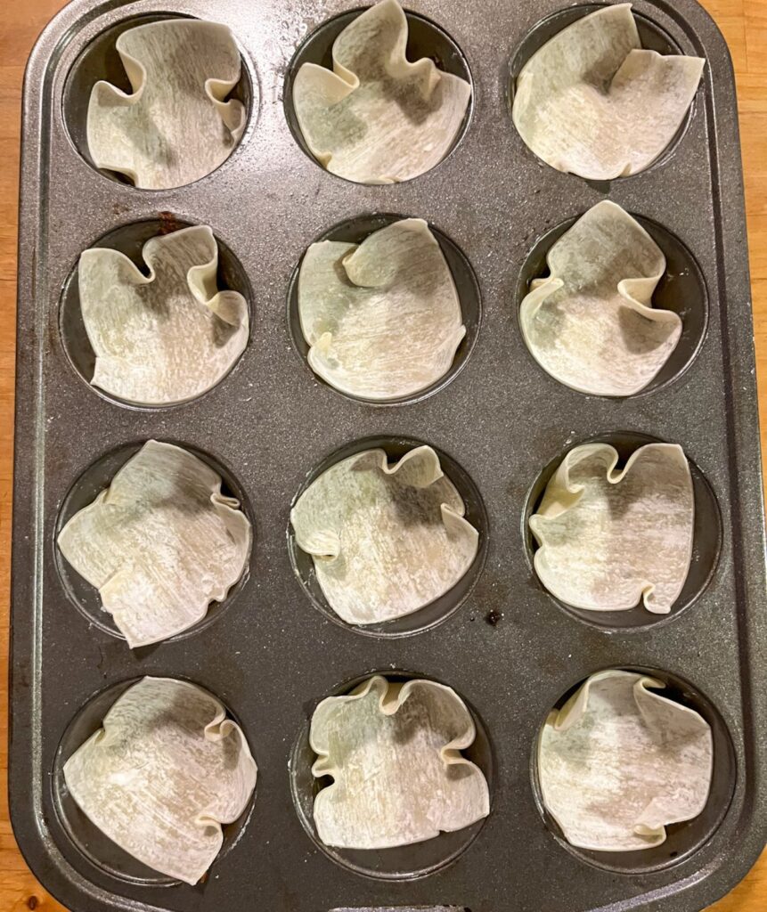 Empty wonton strips in a muffin tin