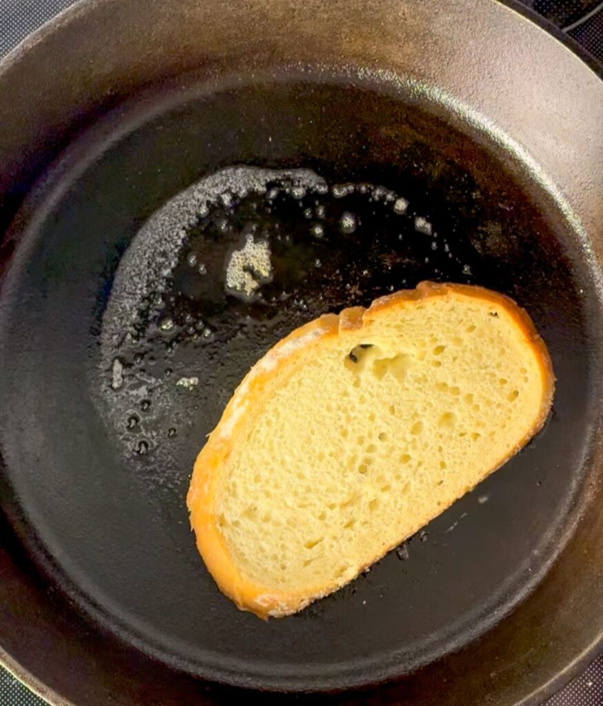 Toasting sourdough bread in a cast iron skillet