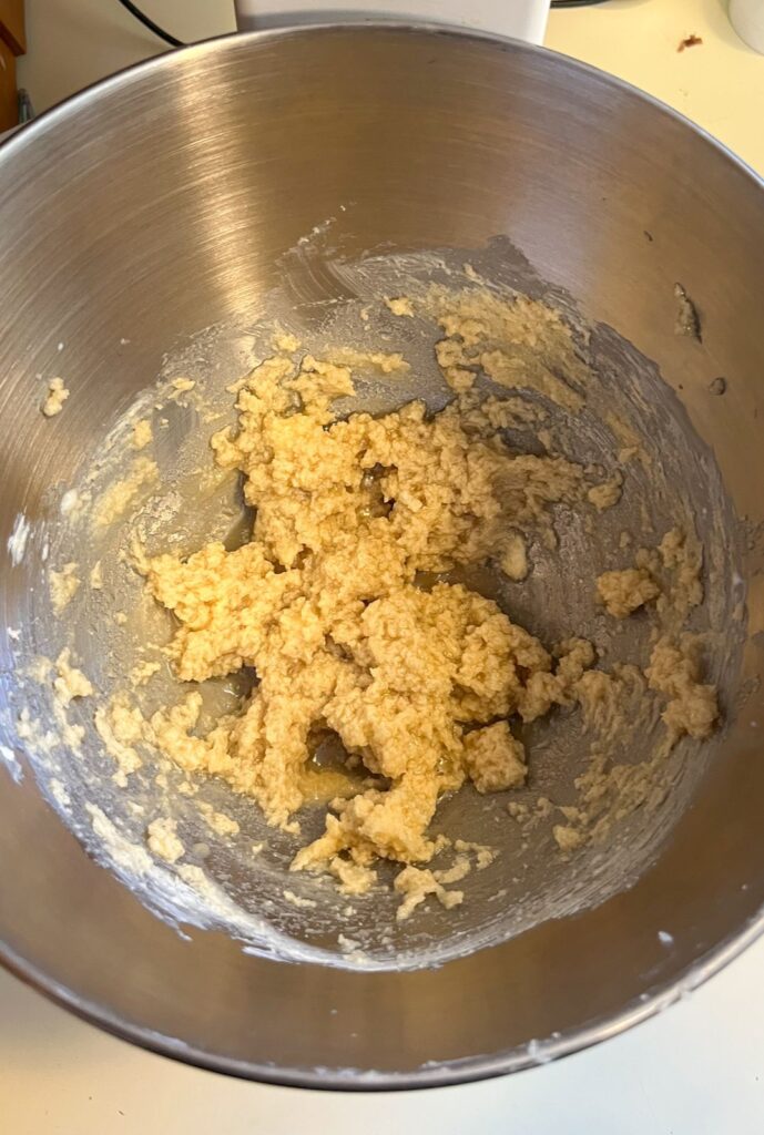 Milk and vanilla added to dough and then creamed together.