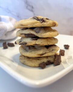 eggless chocolate chip cookies stacked on top of each other