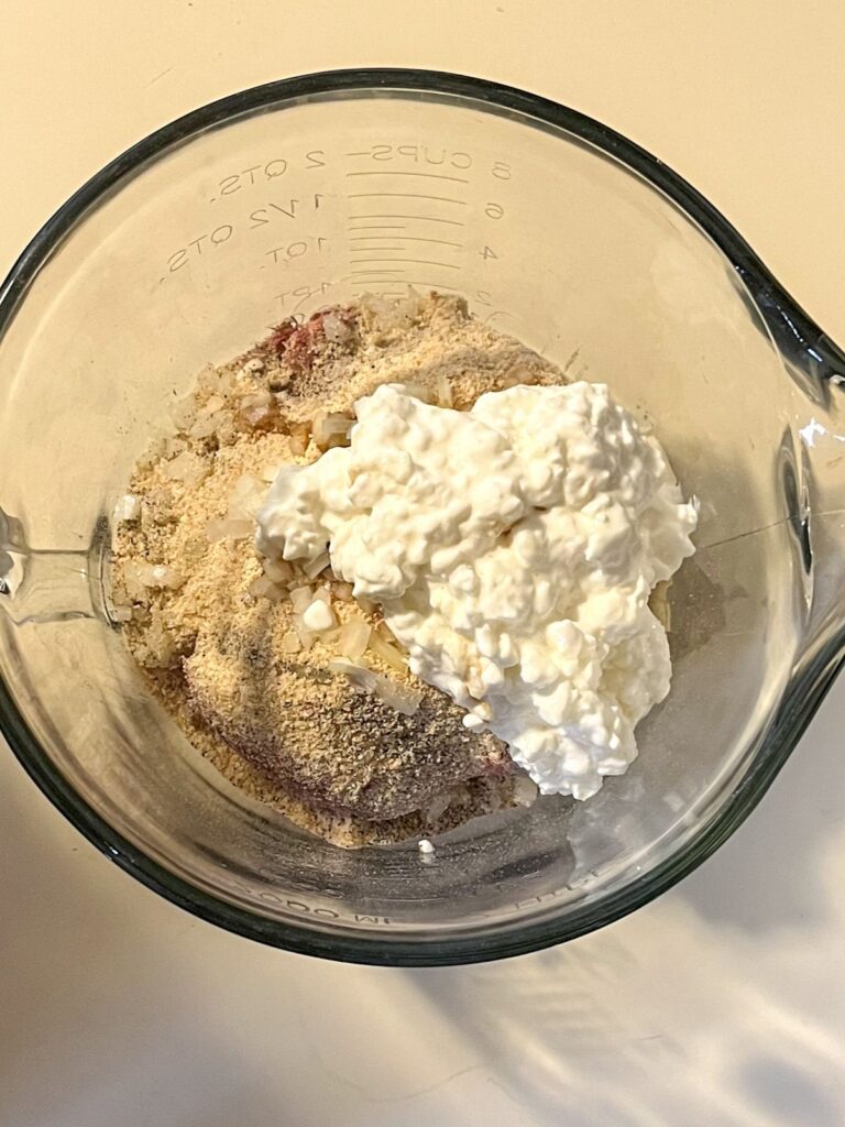 Meatball ingredients in a large mixing bowl