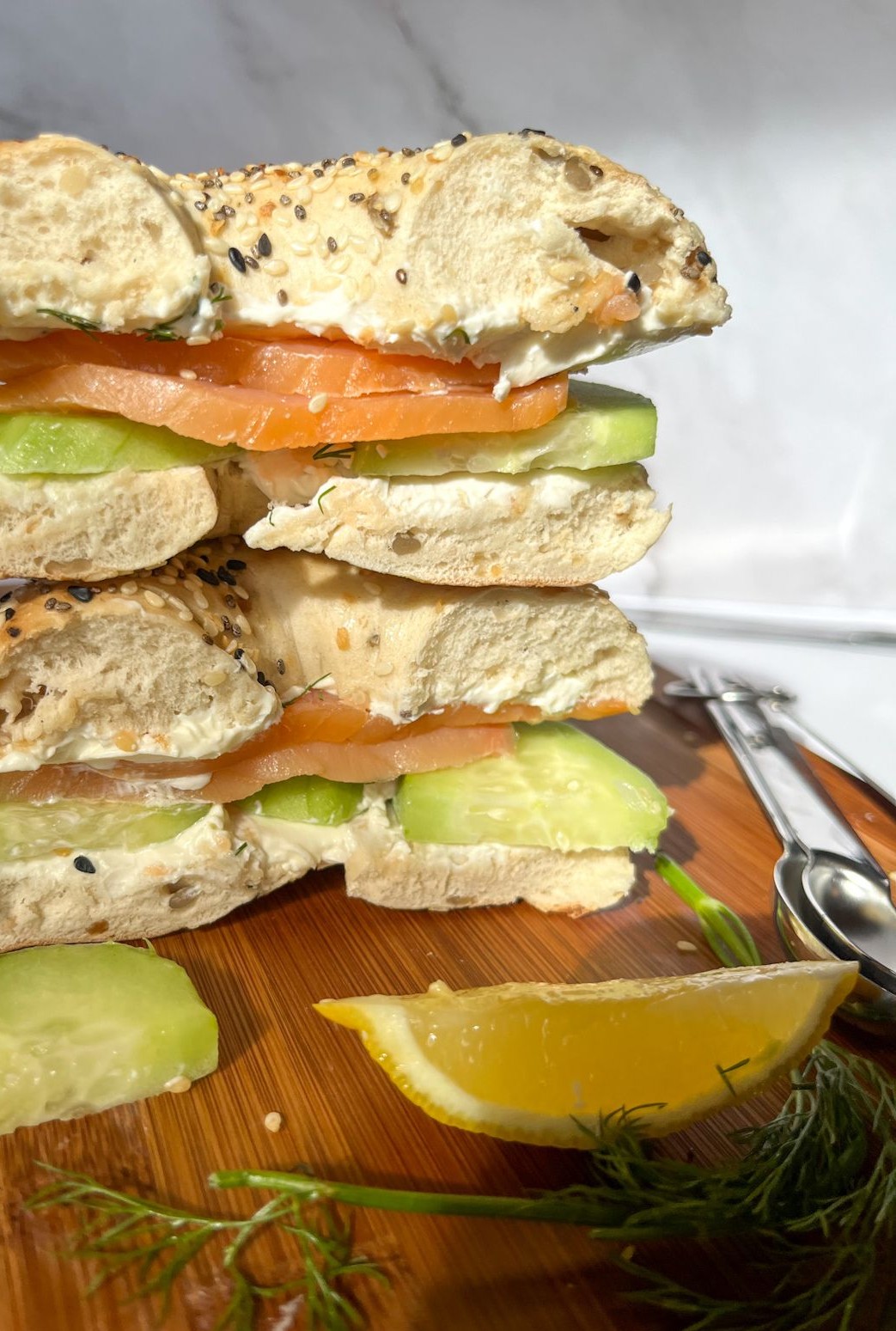 Smoked salmon bagel with ingredients around it