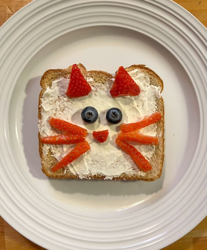 Piece of toast decorated as a cat