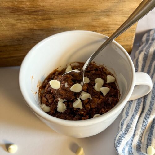 Eggless Chocolate Mug Cake served with a spoon