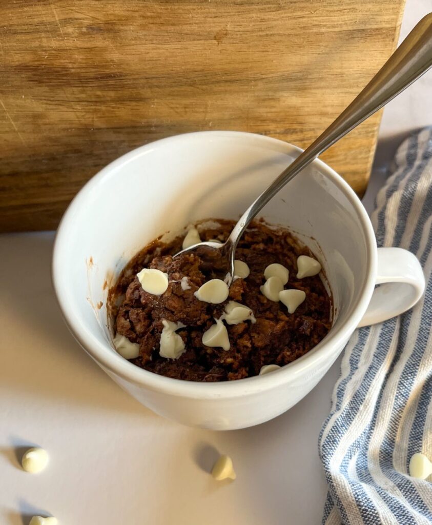 Eggless Chocolate Mug Cake served with a spoon