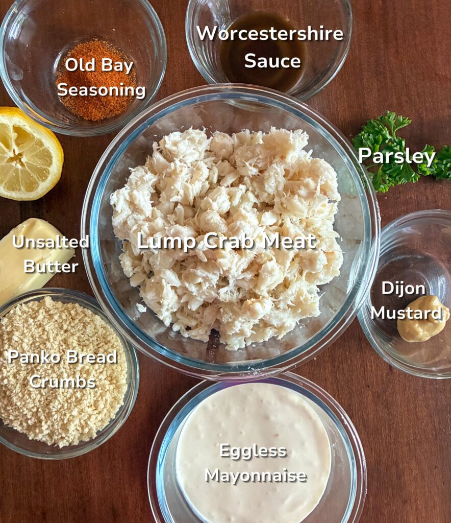 Ingredients for crab cakes in individual bowls with labels on them