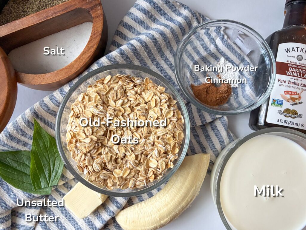 Ingredients for blender oatmeal pancakes in dividual glass bowls and laid out on a table.