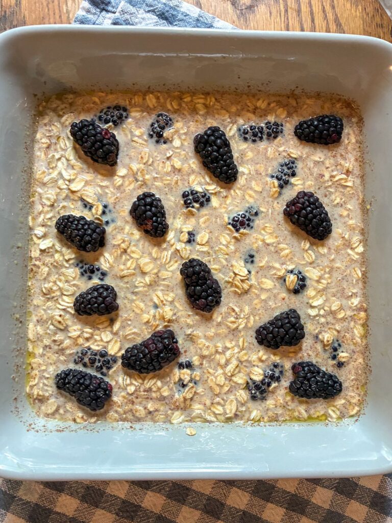 blackberry oatmeal bake topped with fresh blackberries prior to baking in the oven