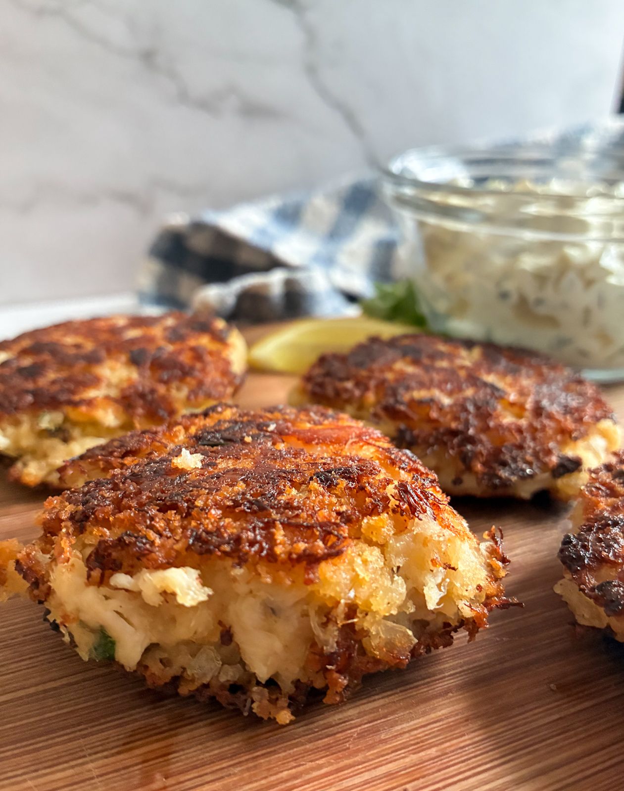 Eggless crab cakes displayed on a cutting board