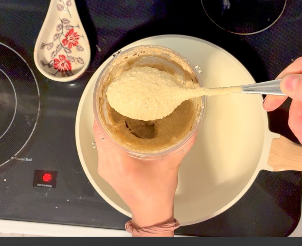 Spoon dipping out some of the pancake batter