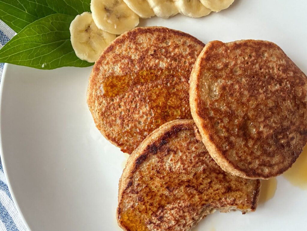 Three oatmeal blender pancakes on a plate