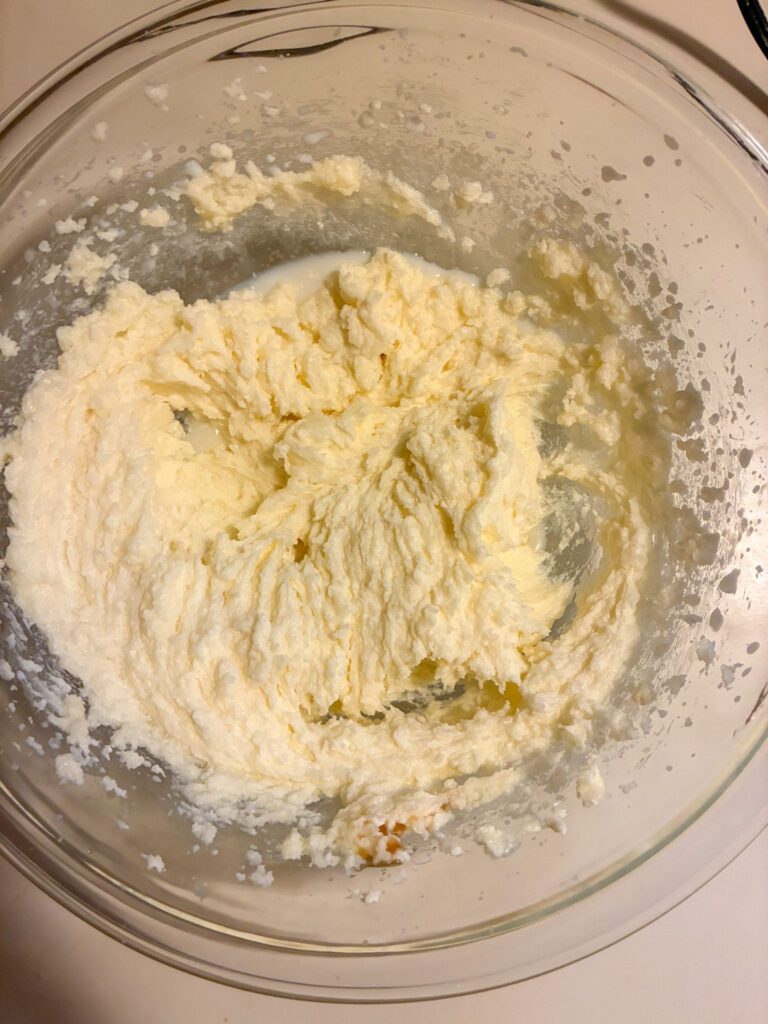 milk and vanilla mixed in the bowl.