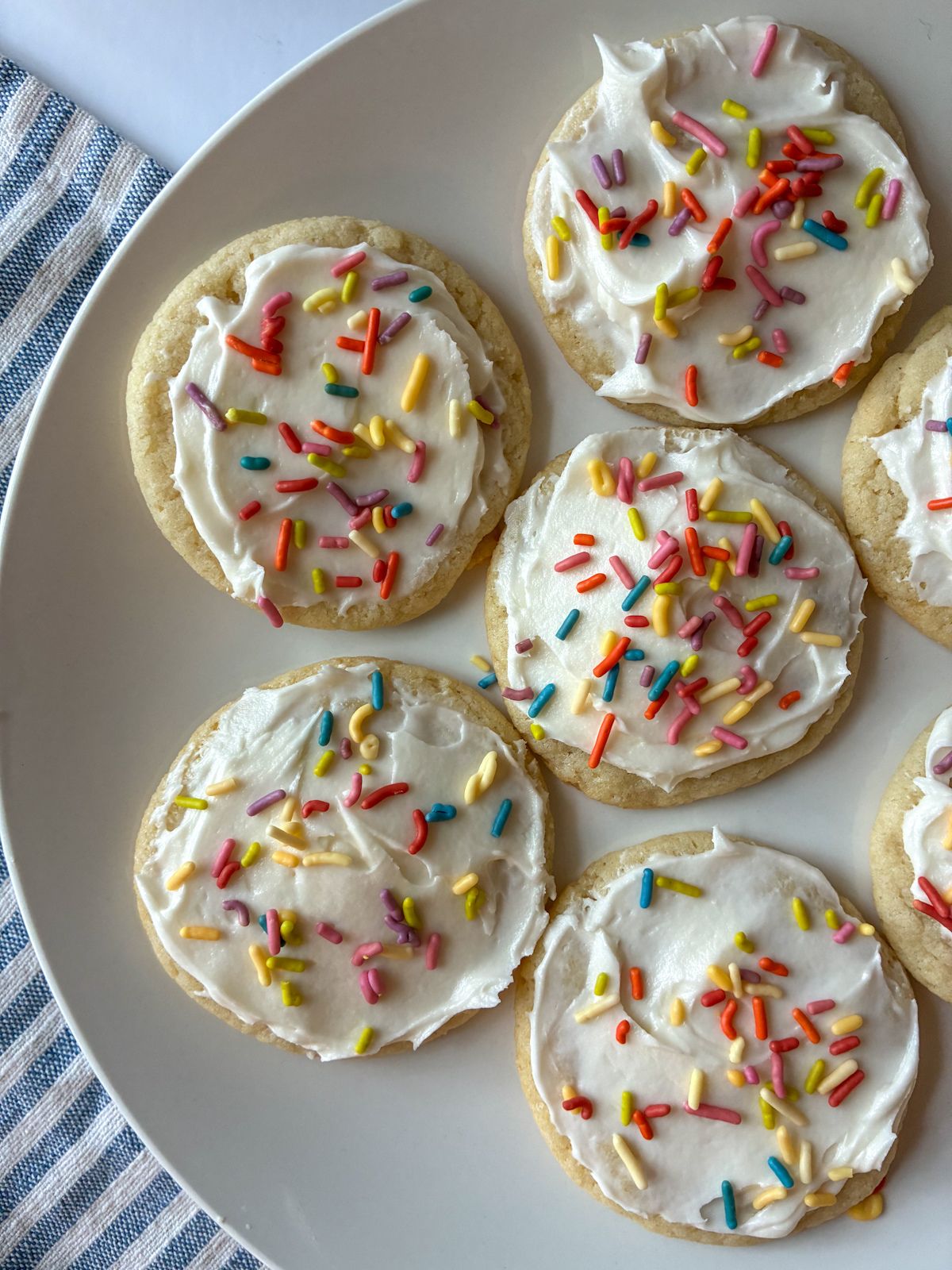 Six eggless sugar cookies on a plate.