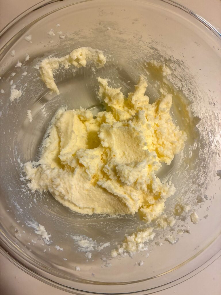 butter and sugar creamed together in a bowl.