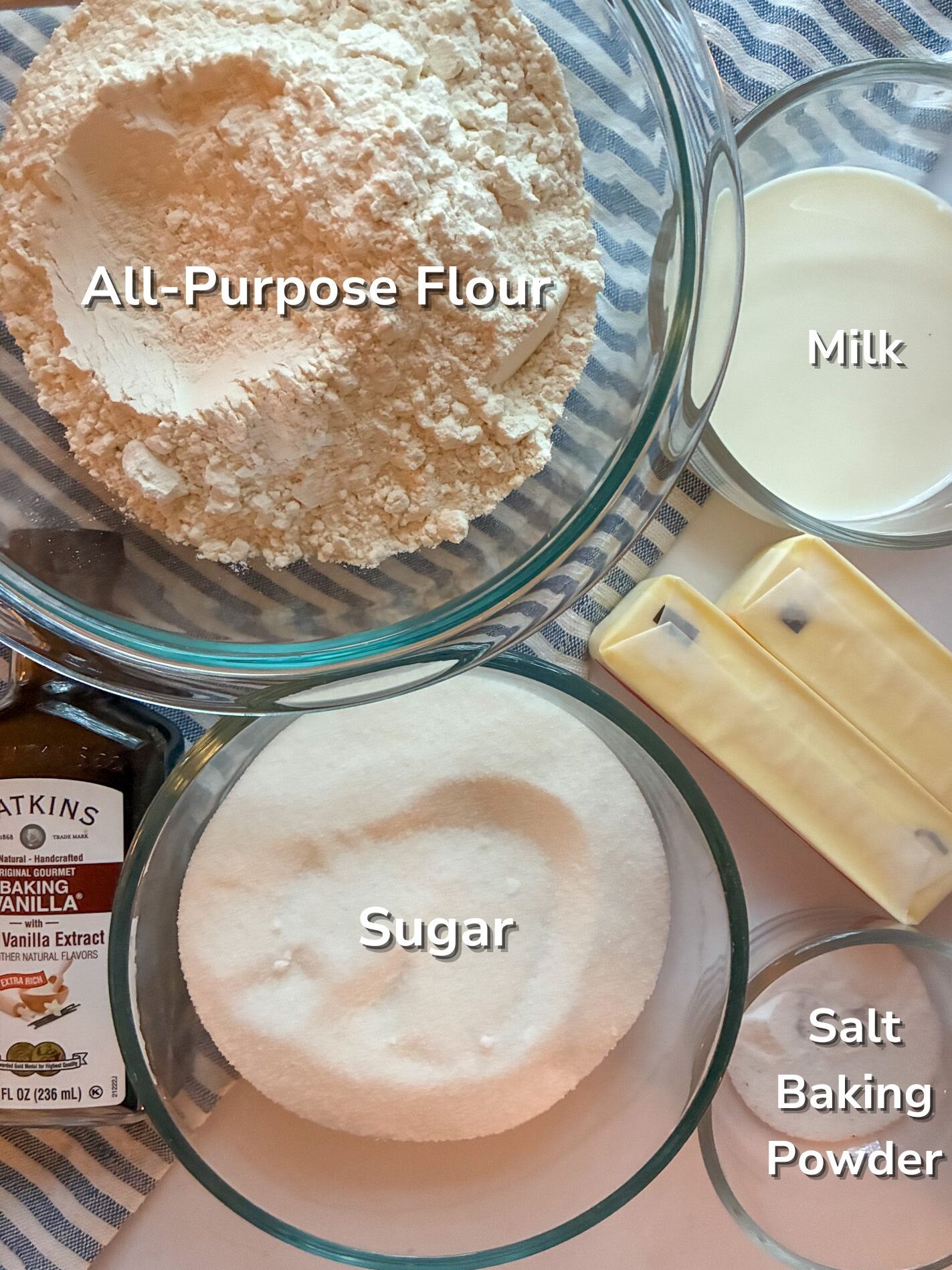 Ingredients for eggless sugar cookies laid out on the table and in bowls