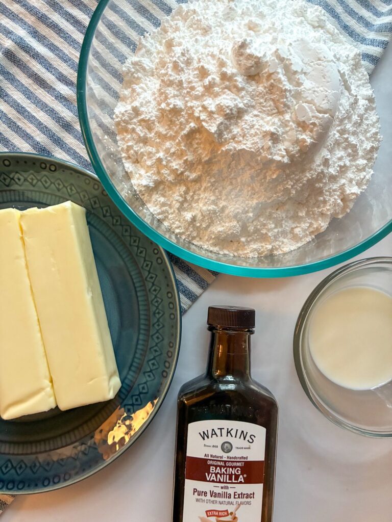 ingredients for easy vanilla frosting laid out on a table