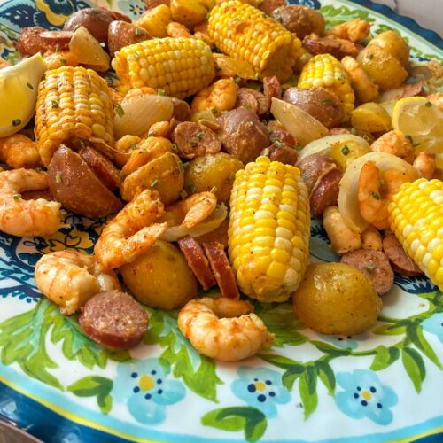 Shrimp and sausage boil served on a large platter.