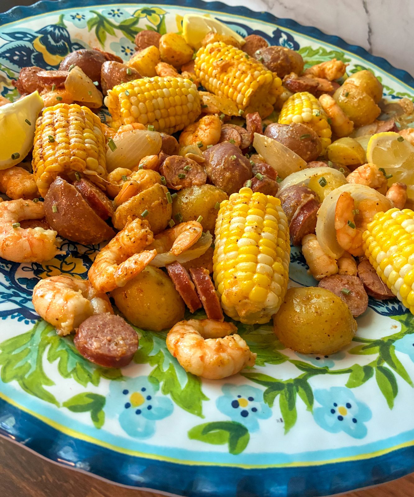 Shrimp and sausage boil served on a large platter.