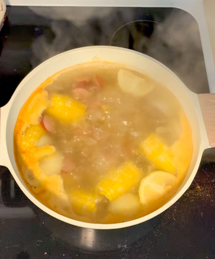 all of the ingredients in a large pot boiling