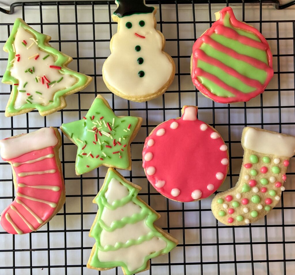 cut out sugar cookies (eggless) decorated and on a drying rack