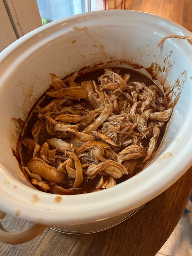 shredded bbq chicken in a slow cooker