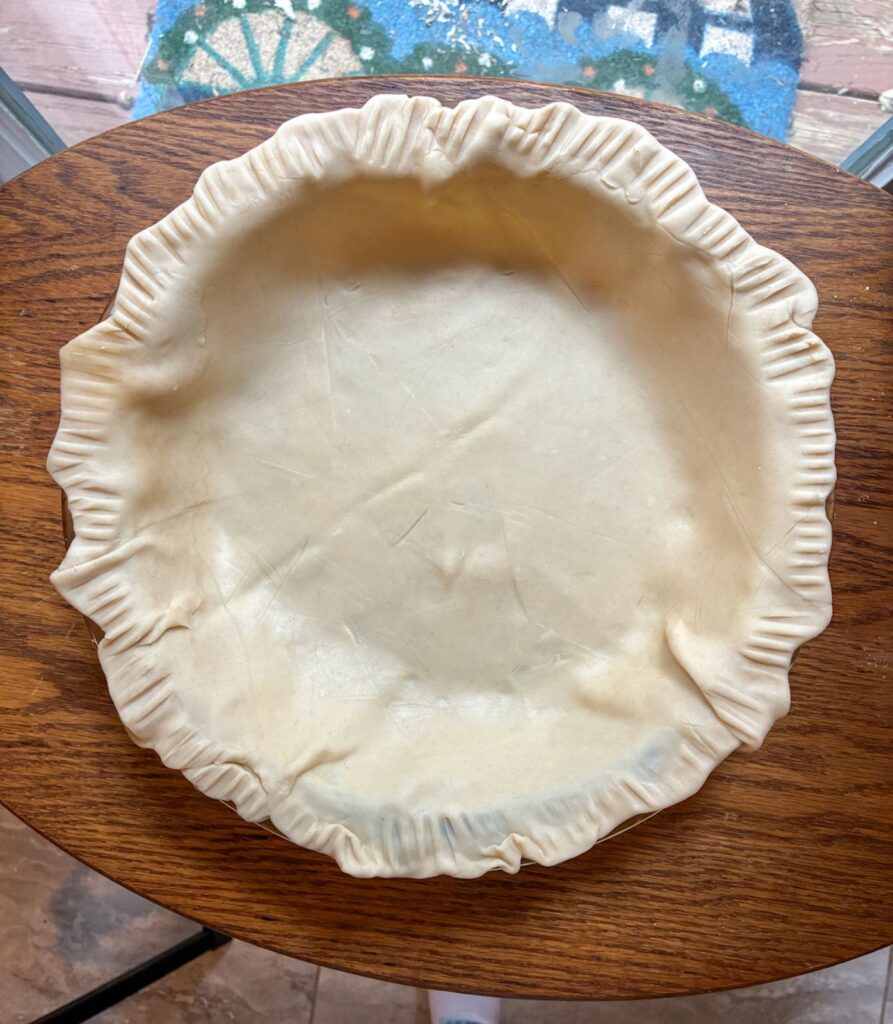 Empty pie crust in the baking dish