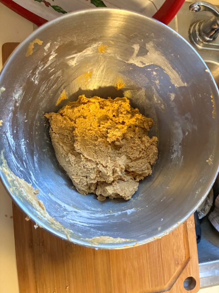 Batter for eggless molasses cookies in a large mixing bowl