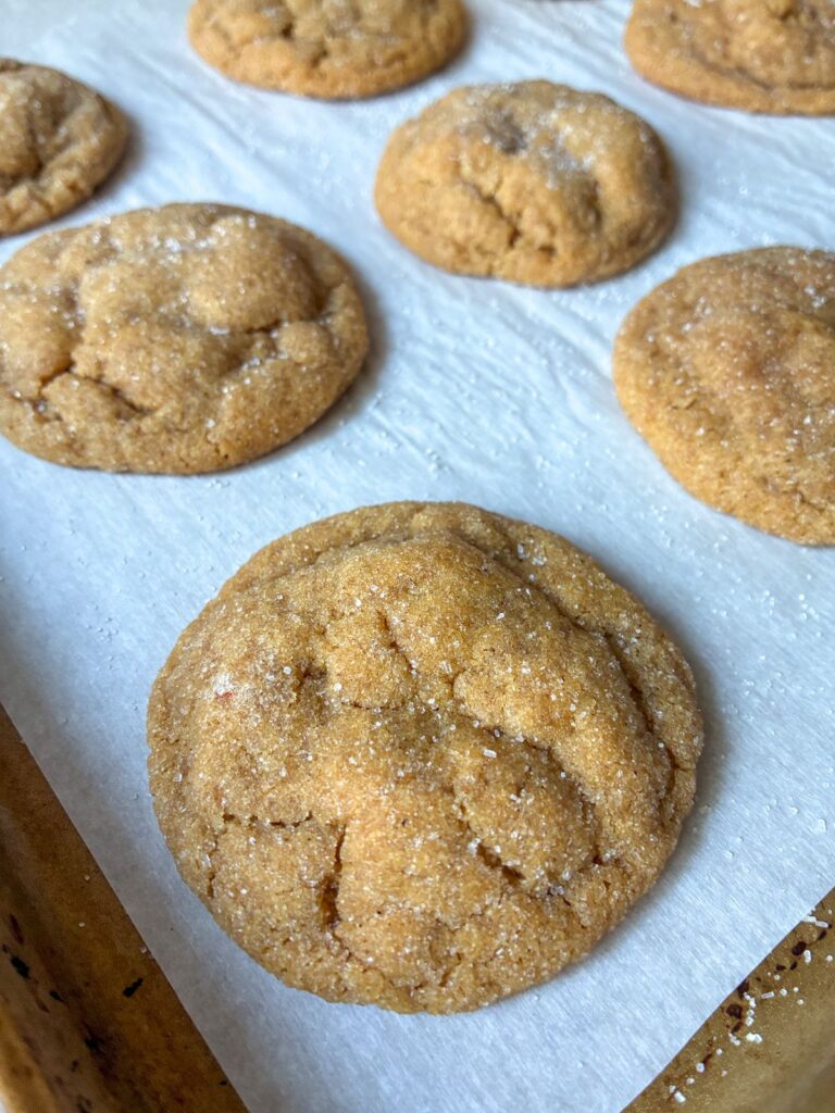 up close picture of cookie on the baking sheet fresh out of the oven