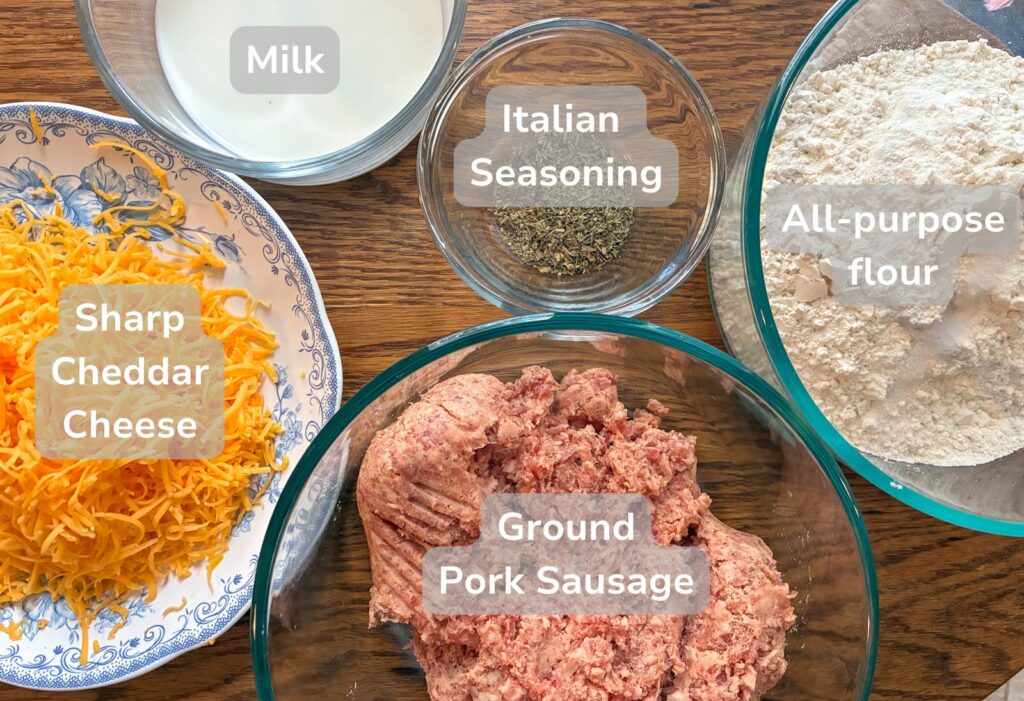 ingredients for sausage ball laid out on a table in individual bowls