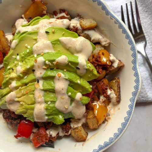 chorizo breakfast bowl with a fork off to the side