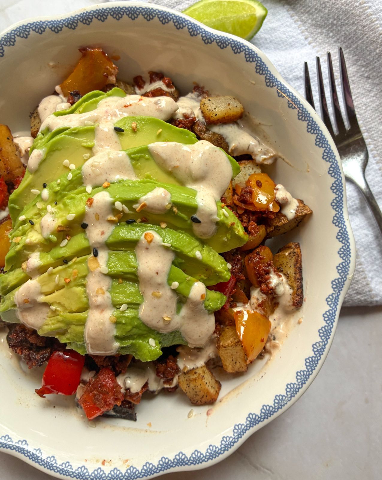 chorizo breakfast bowl with a fork off to the side