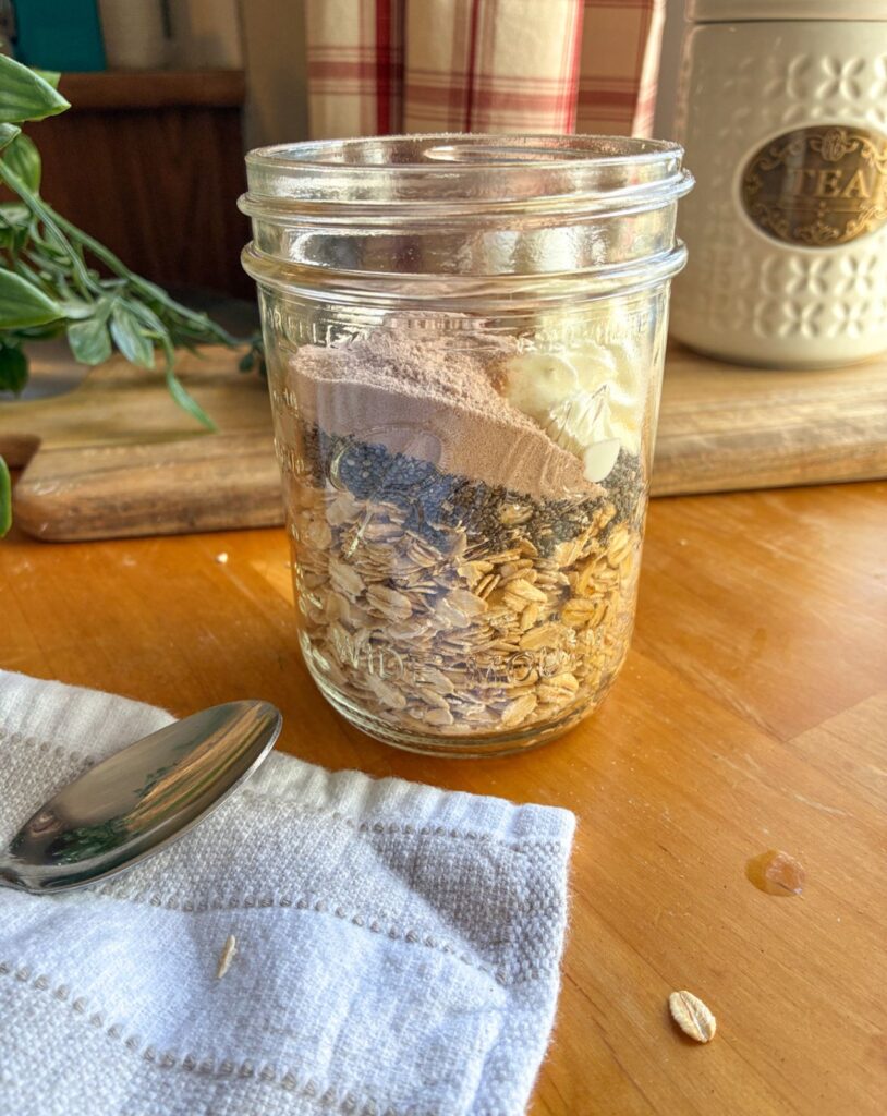 Dry ingredients added to mason jar for overnight oats without peanut butter
