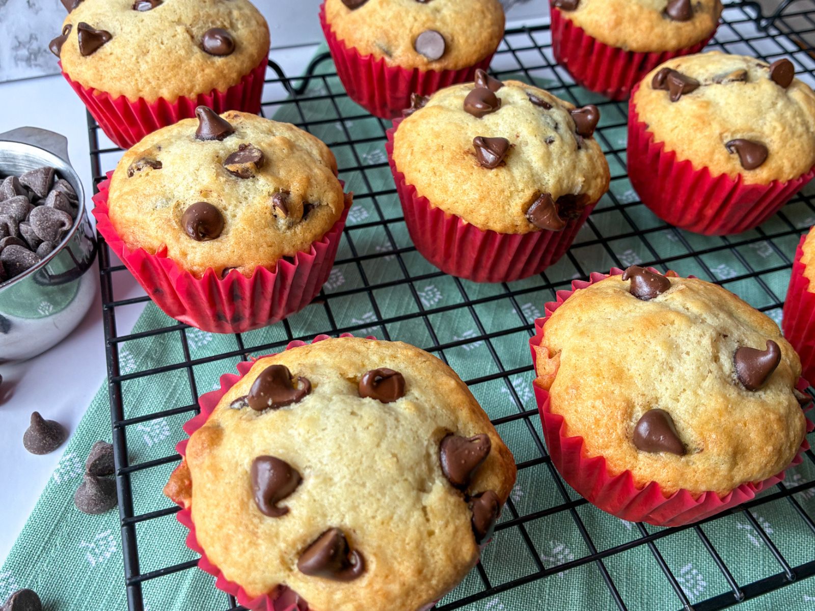 eggless chocolate chip muffins on a drying wrack