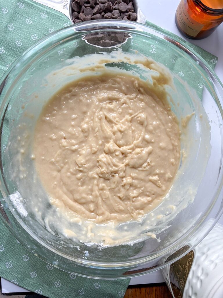 Batter prior to chocolate chips being added in a large bowl for eggless chocolate chip muffins
