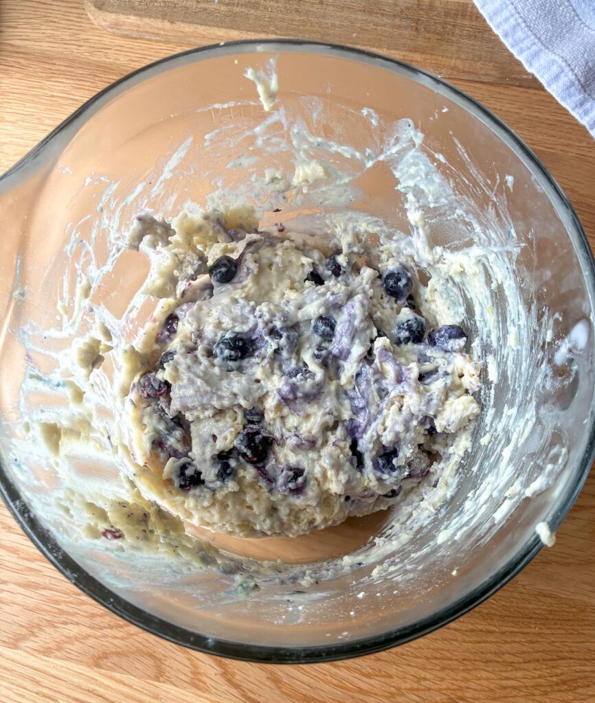 Batter for lemon blueberry eggless muffins in a large bowl