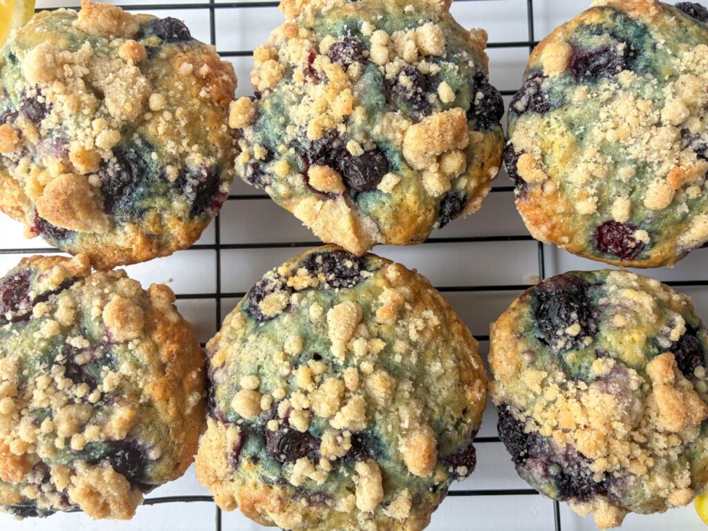 6 eggless lemon blueberry muffins on a cooling rack