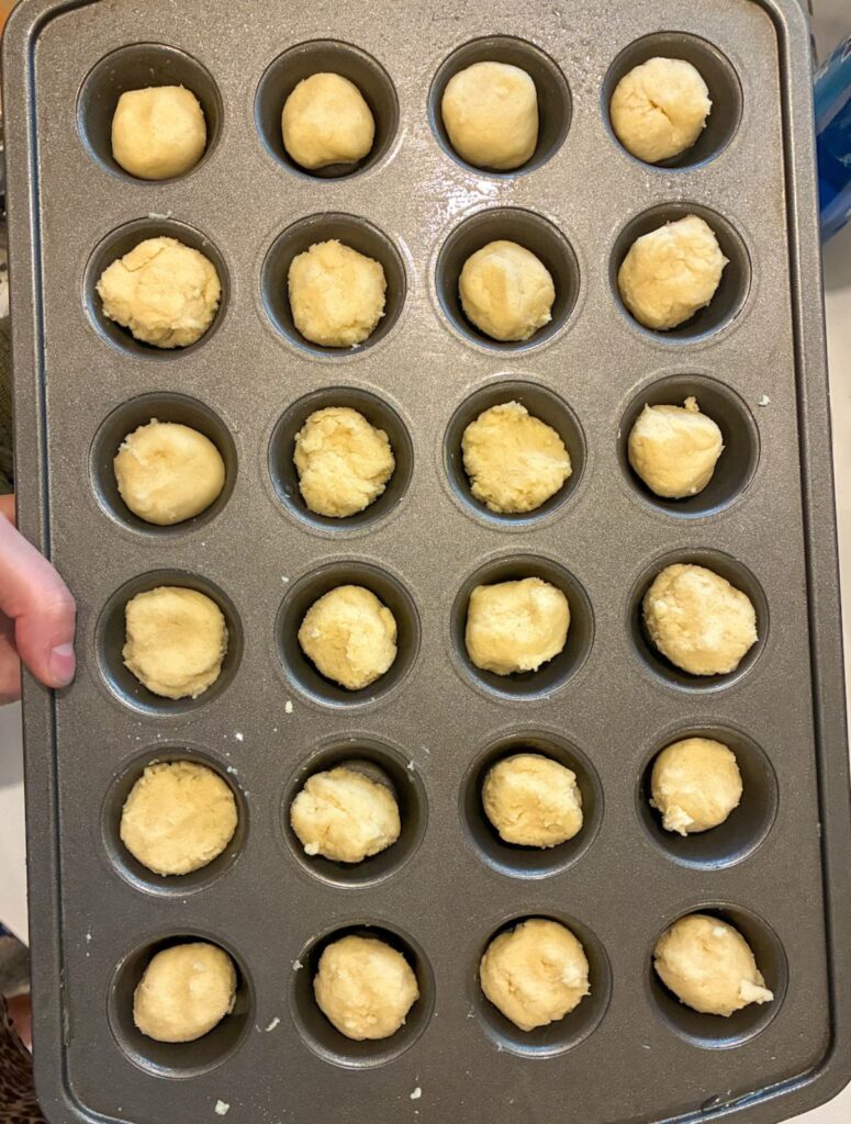 dough in the mini muffin tin