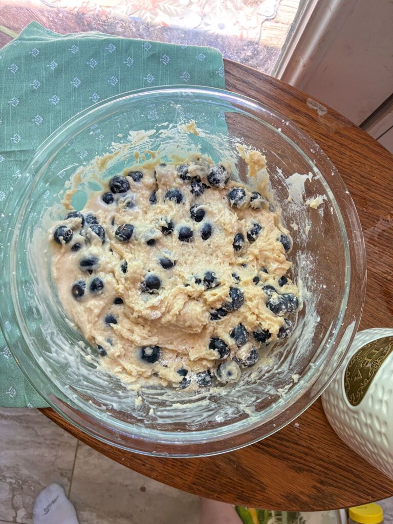 Batter for eggless blueberry muffins in a large bowl