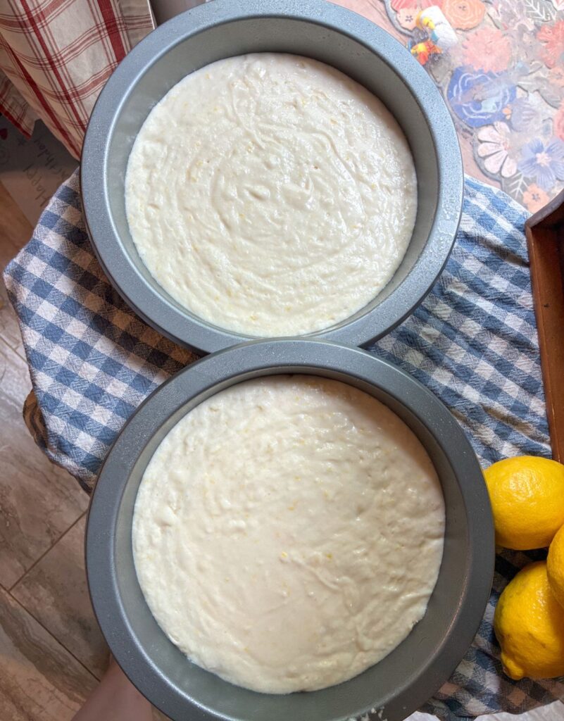 eggless lemon cake batter in two pans