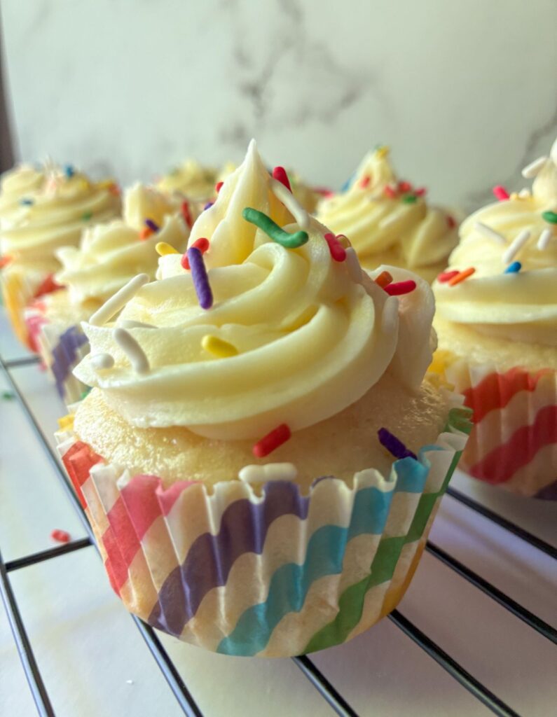 eggless vanilla cupcake on a cooling rack