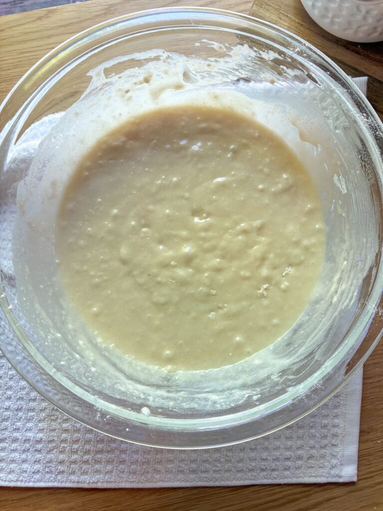 Batter in a large bowl for eggless vanilla cupcakes