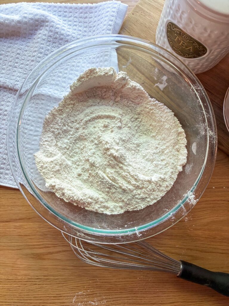 Dry mixture in a large bowl for eggless vanilla cupcakes