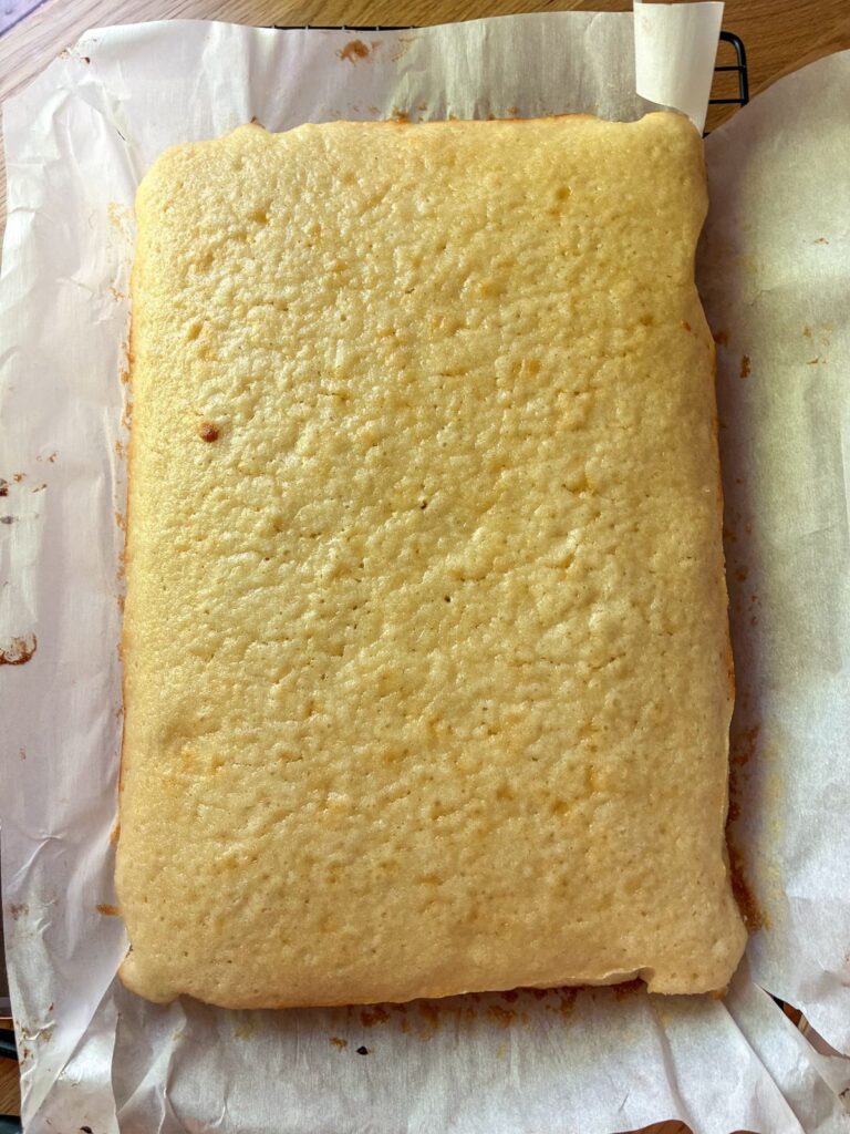 Eggless vanilla sheet cake out of the oven and cooled prior to being frosted