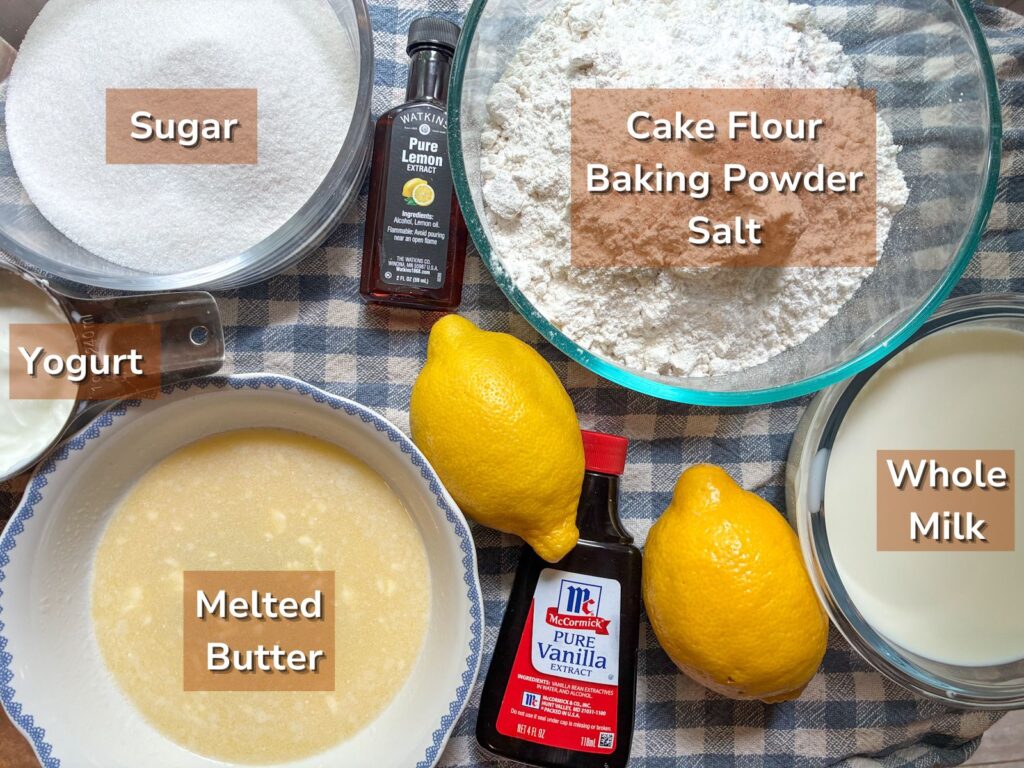Ingredients for eggless lemon cake laid out on a table