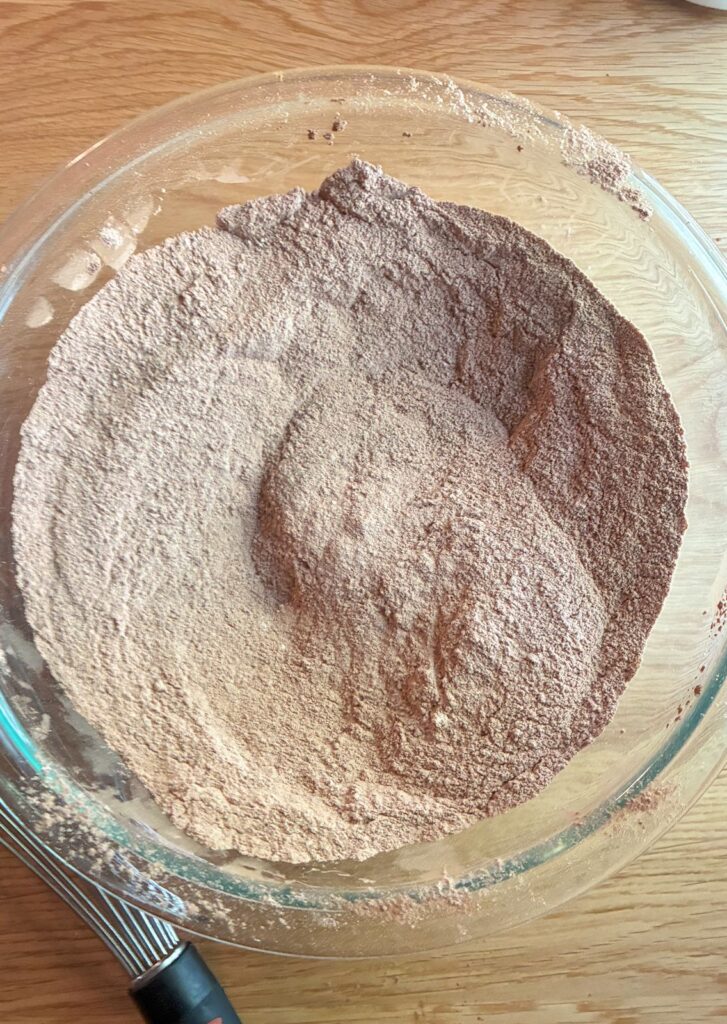 Dry ingredients in a large bowl for eggless chocolate cake