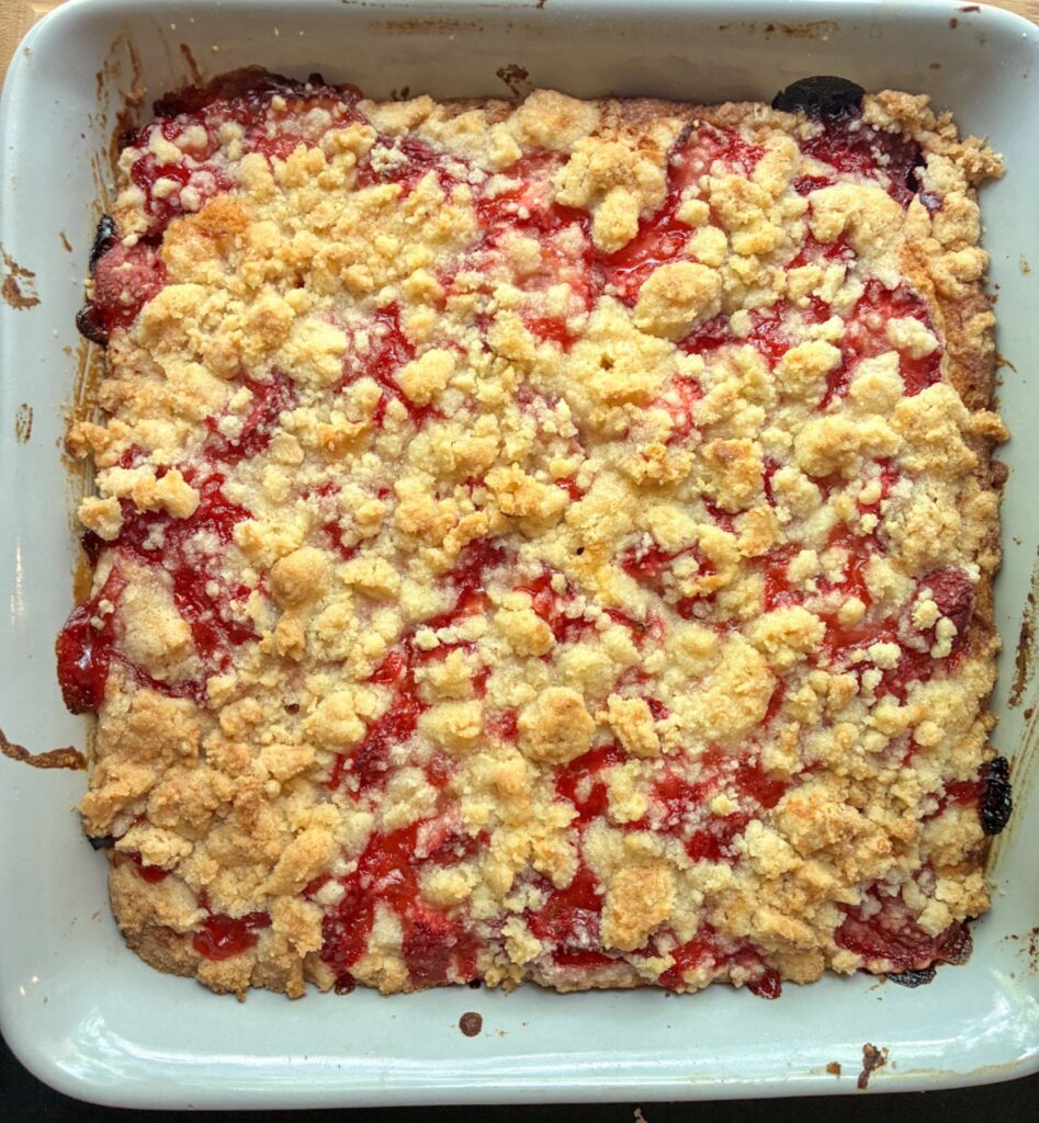 Strawberry crumble cake fresh out of the oven still in the pan