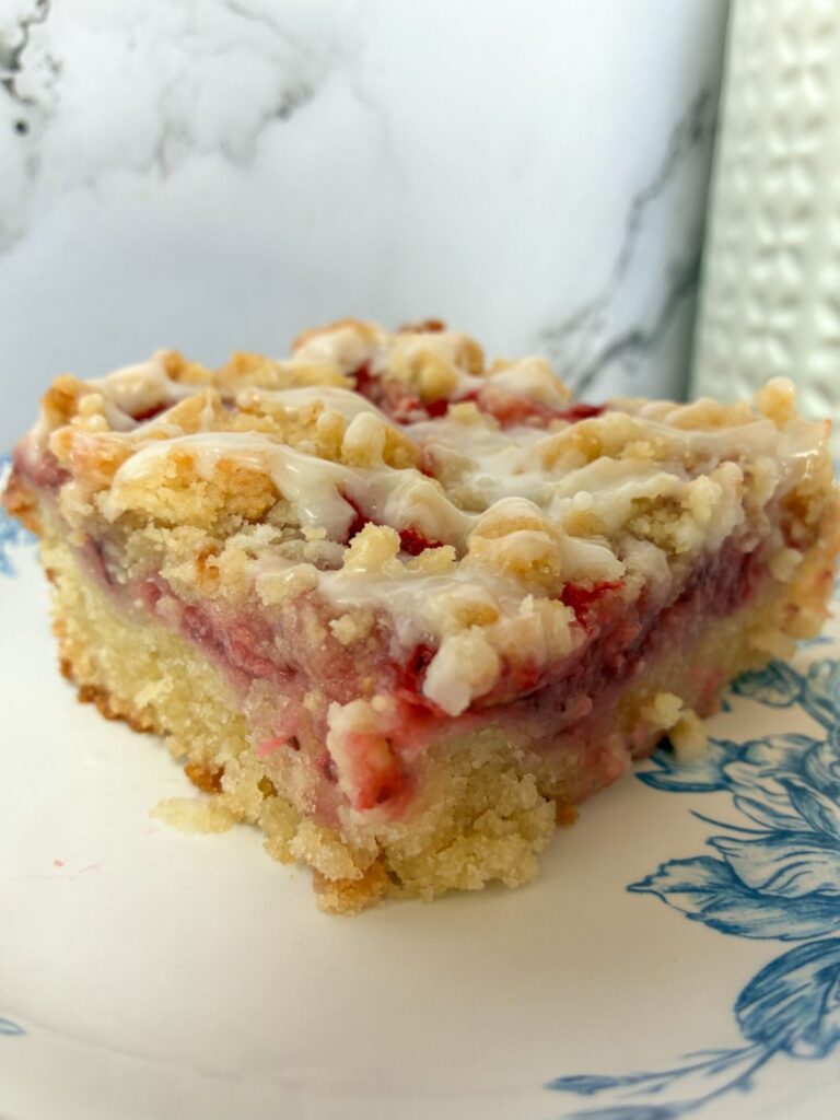 Strawberry crumb cake slice on a plate